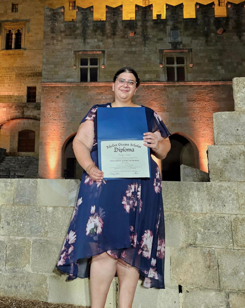 Dr. Emily Nocito with her diploma after completing the Rhodes Academy coursework